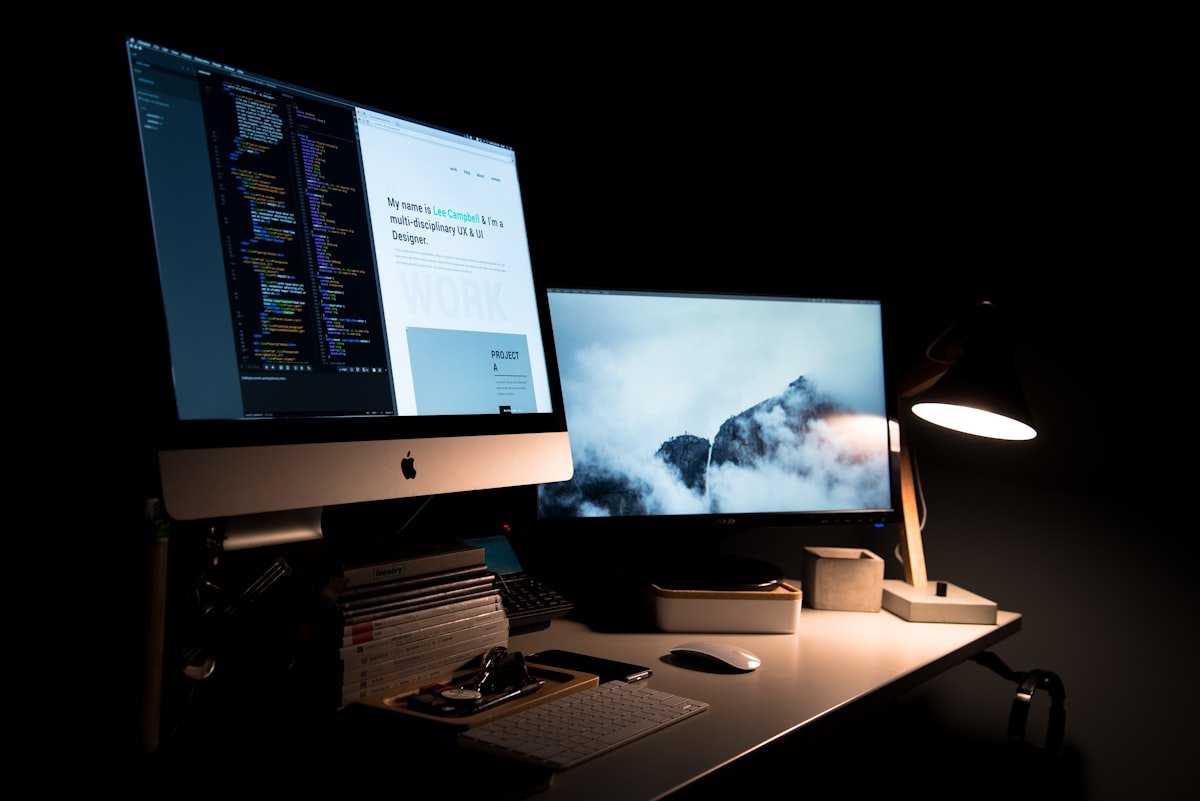 Designer building a professional website on a laptop